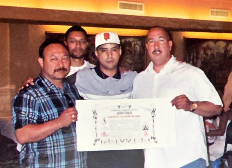 Masters Degree certificate presentation in Cabales Serrada Escrima, three men holding the framed diploma